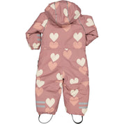 Old pink winter overall with heart pattern, hood, and reflective details seen from behind by Geggamoja.